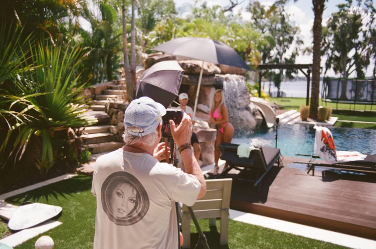 Hooters Calendar photographer Doug Vollmer shooting poolside