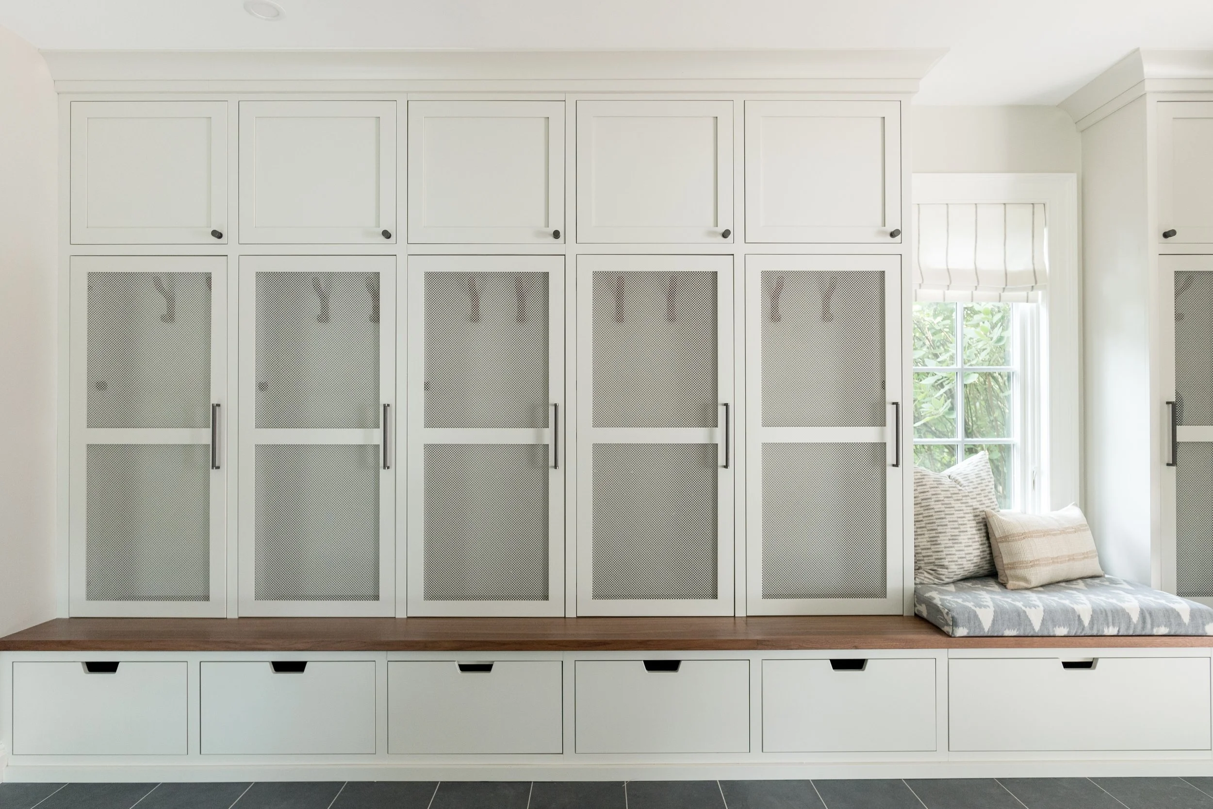 functional custom cabinet mudroom with mesh panels.jpg