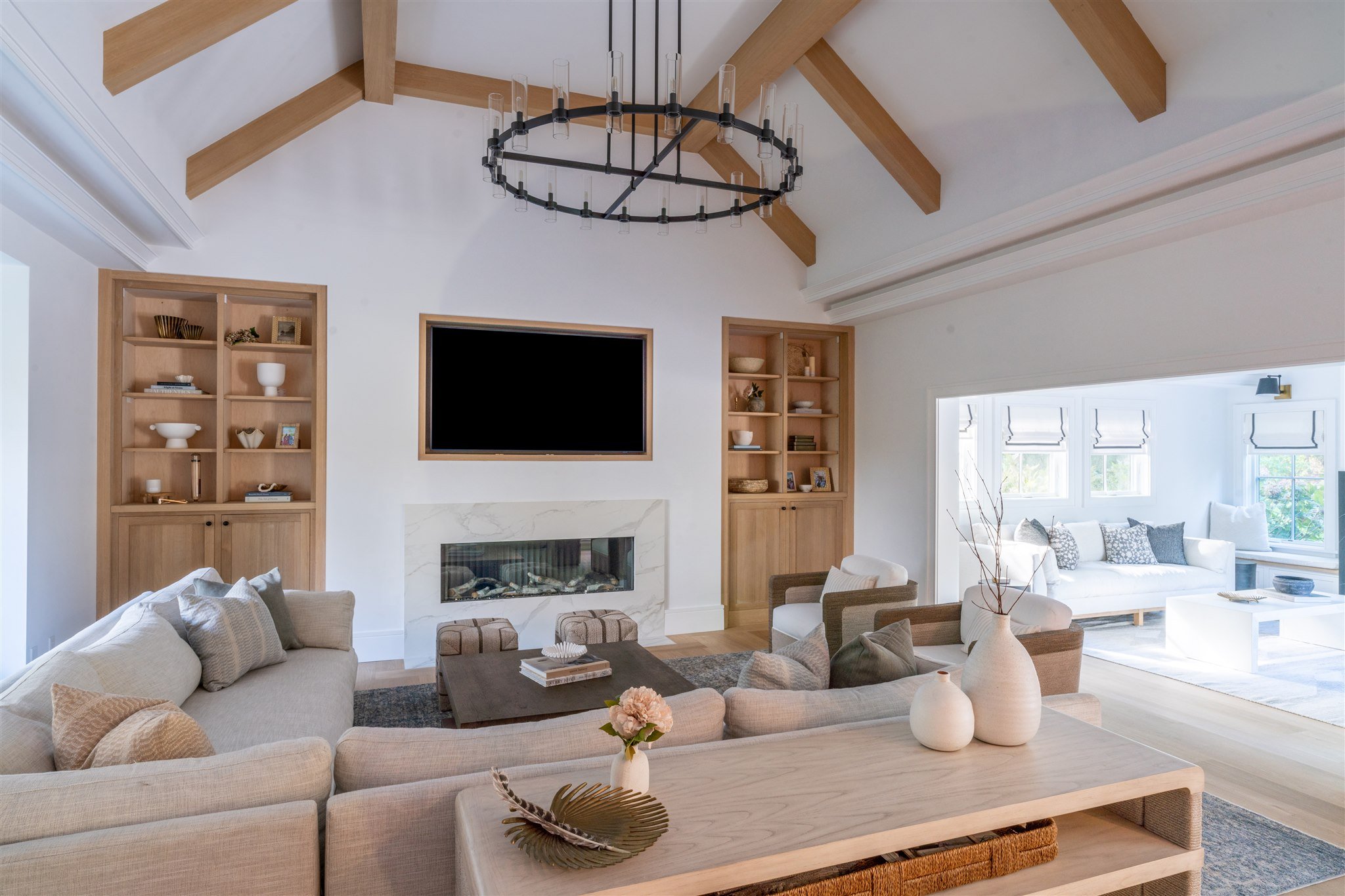 Luxury Living Room Design with Vaulted Ceiling and Custom Fireplace Built-ins.jpg