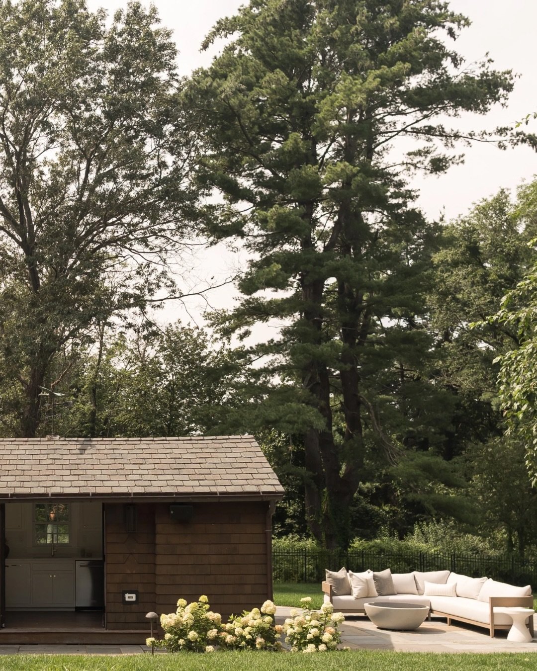 Tucked on the North Shore of Massachusetts, this property feels worlds away in the best way. We gut renovated the main home but poolside needed lots of love too. 

An original shed on the property was transformed into the perfect pool house without a