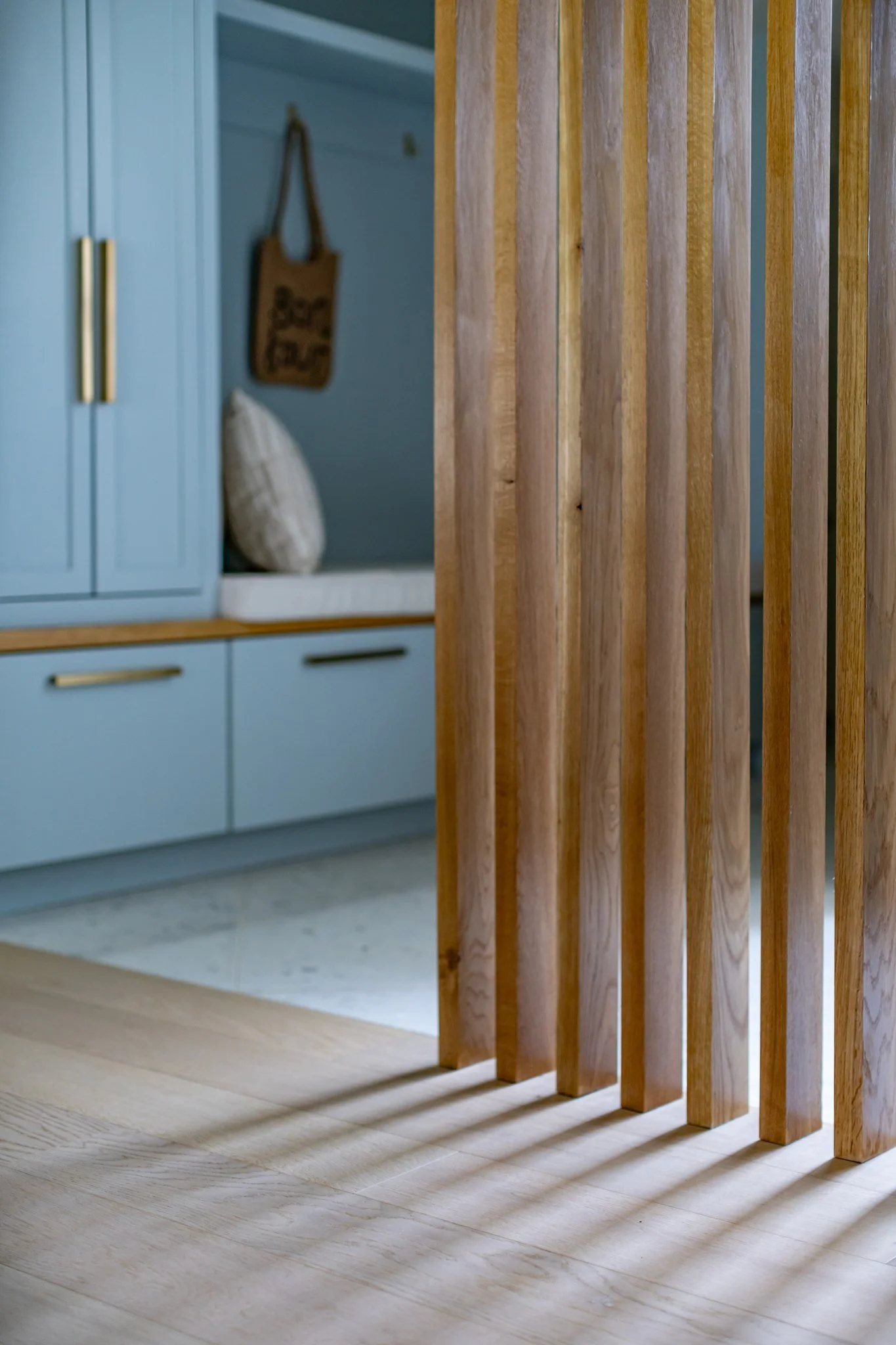 custom-white-oak-wood-slat-room-divider-mudroom.jpg