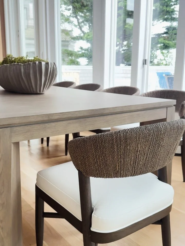 We designed this custom millwork to create an easy transition between the kitchen and eat-in dining space. With soaring ceilings and walls of windows, the goal was to make the two spaces feel connected while still giving the dining area its own ident