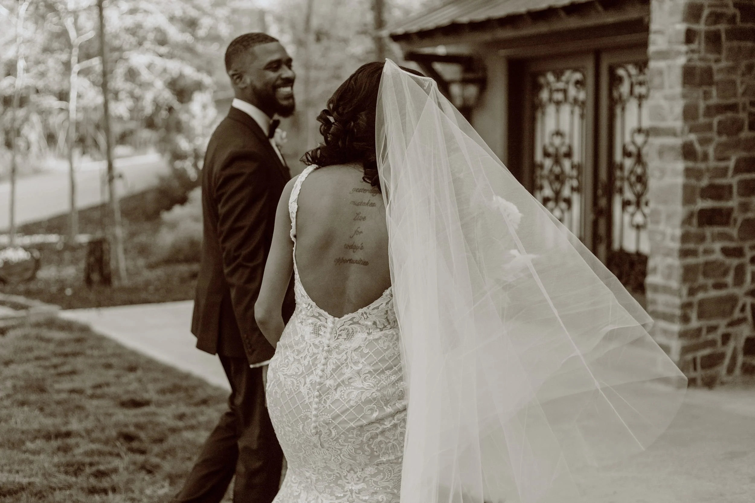 Romantic bride and groom exiting their wedding ceremony at garden-style wedding venue