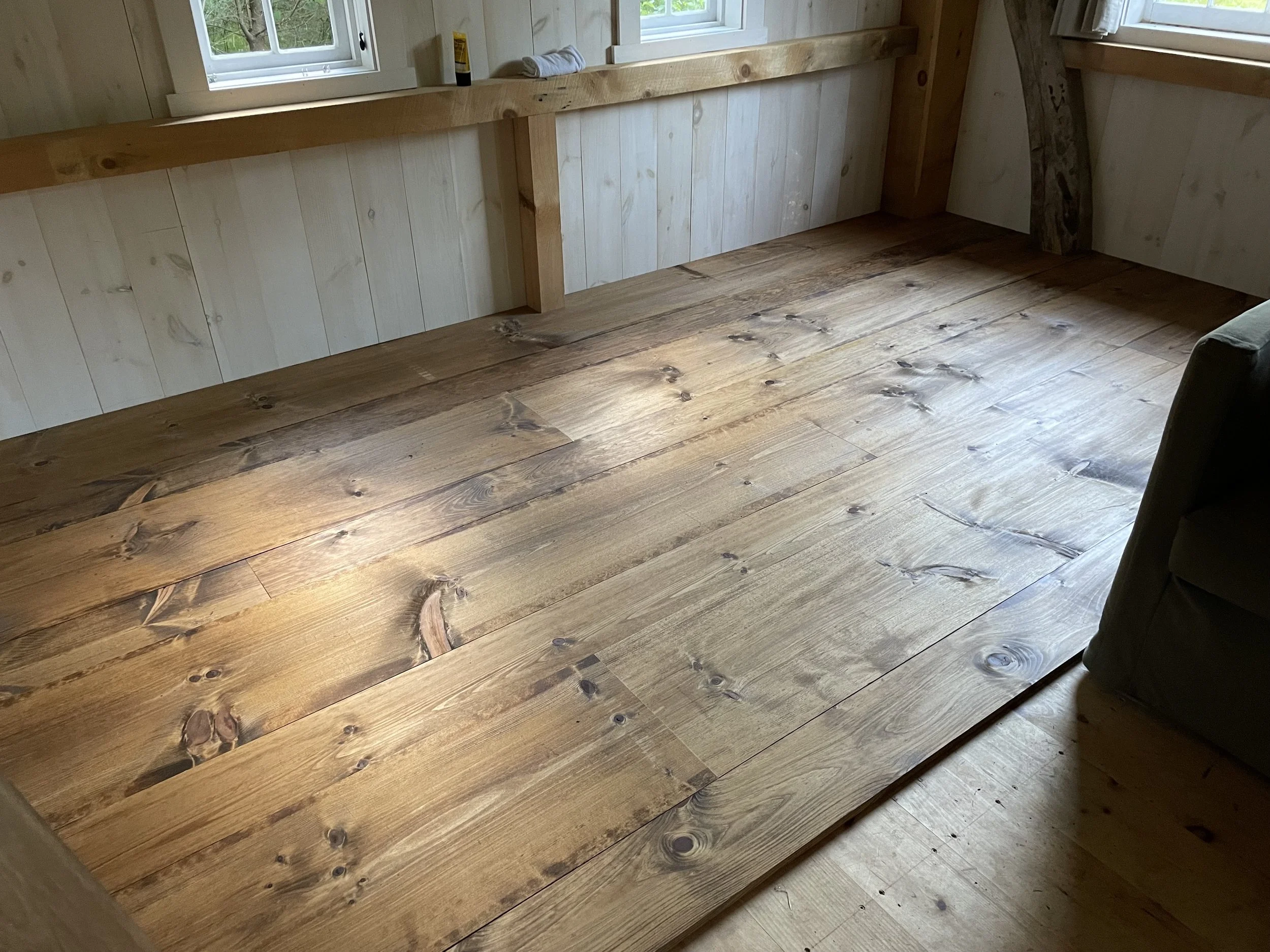 The floors are stained with dark tung oil and put place using (so many!) square head nails.