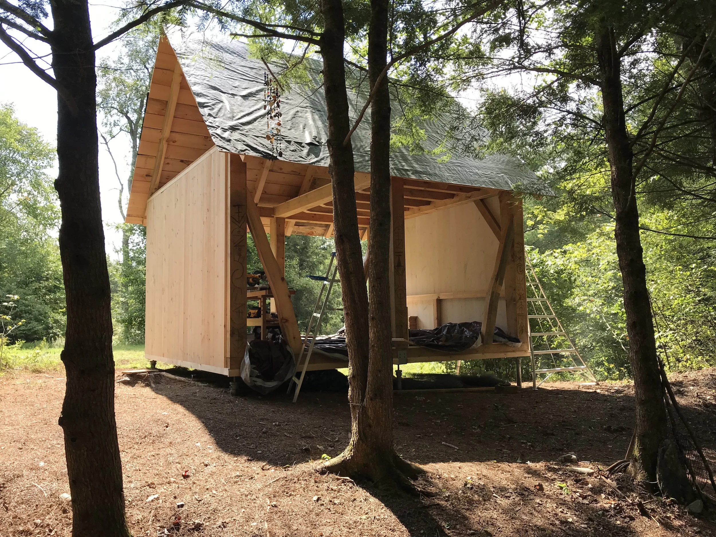 The first of the inside walls go on. These are shiplap wood painted with milk paint.
