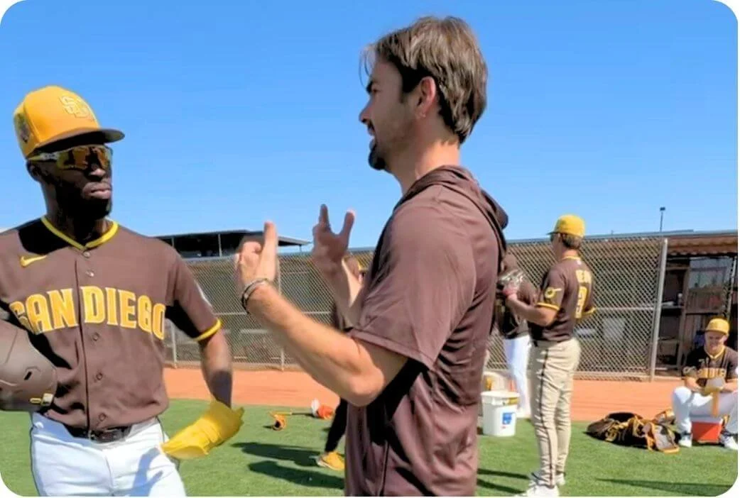 Reis Paluso talking to a San Diego Padres baseball player about breathing for performance at Spring Training in Peoria, AZ.