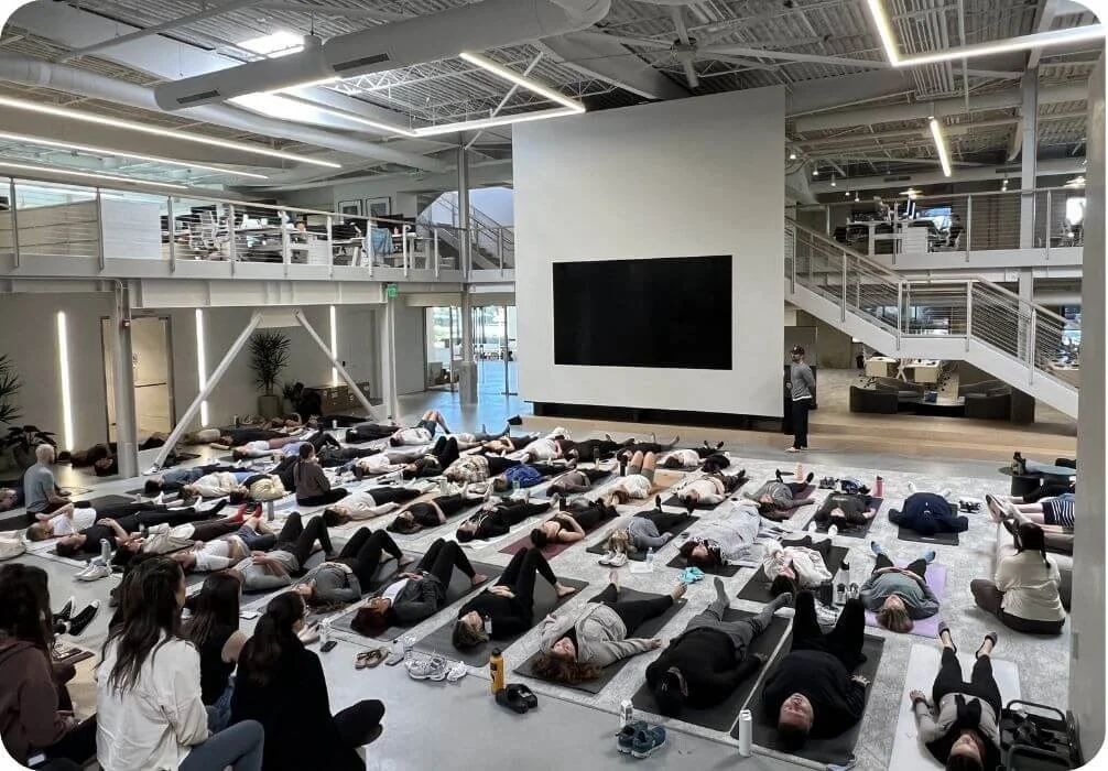 Reis Paluso leading a breath practice at the Vuori headquarters in Carlsbad, CA