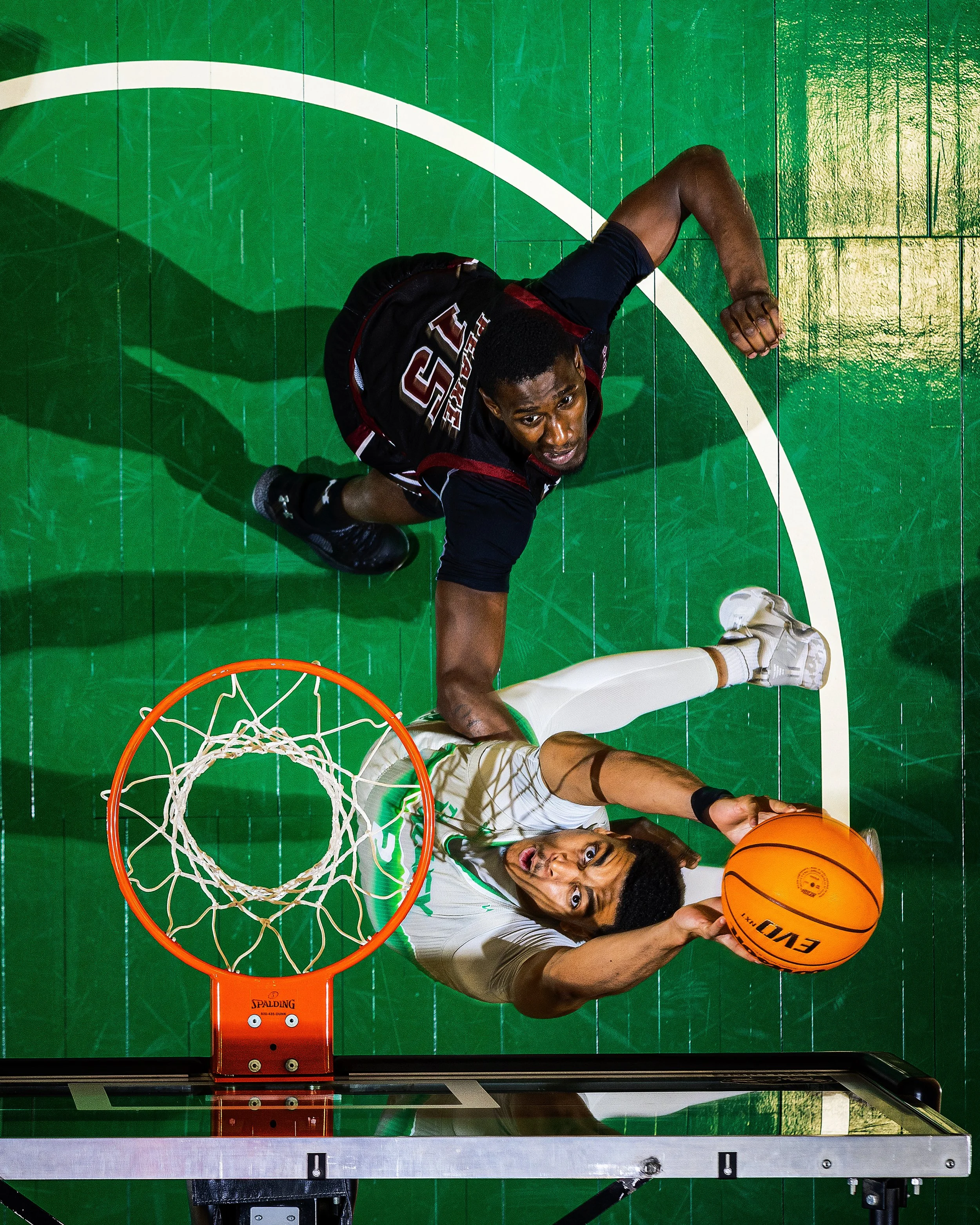 *Utah Valley University forward Tim Ceaser (2) rebounds the ball while he’s guarded by New Mexico State University forward Mike Peake (15) during an NCAA basketball game held at the UCCU Center on the campus of UVU in Orem, Utah, on Saturday, Feb. 12