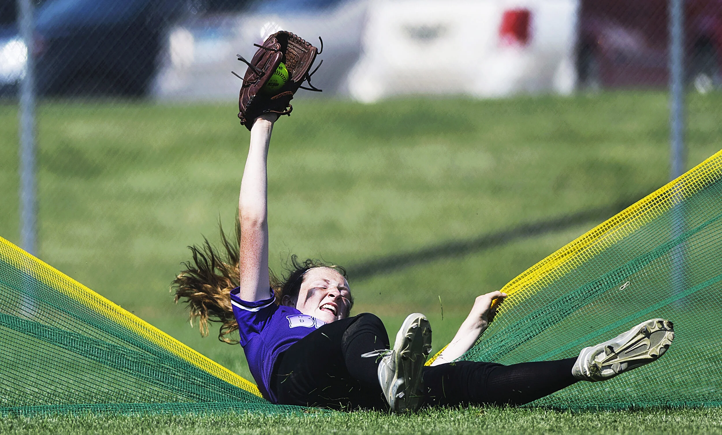 Buffalo freshman left fielder Jordan Zrust steals a home run in the third inning of a game against Chanhassen. “I was going to get the ball, no matter what,” Zrust said after the game. Buffalo defeated Woodbury 3-1 in the Minnesota State High School 