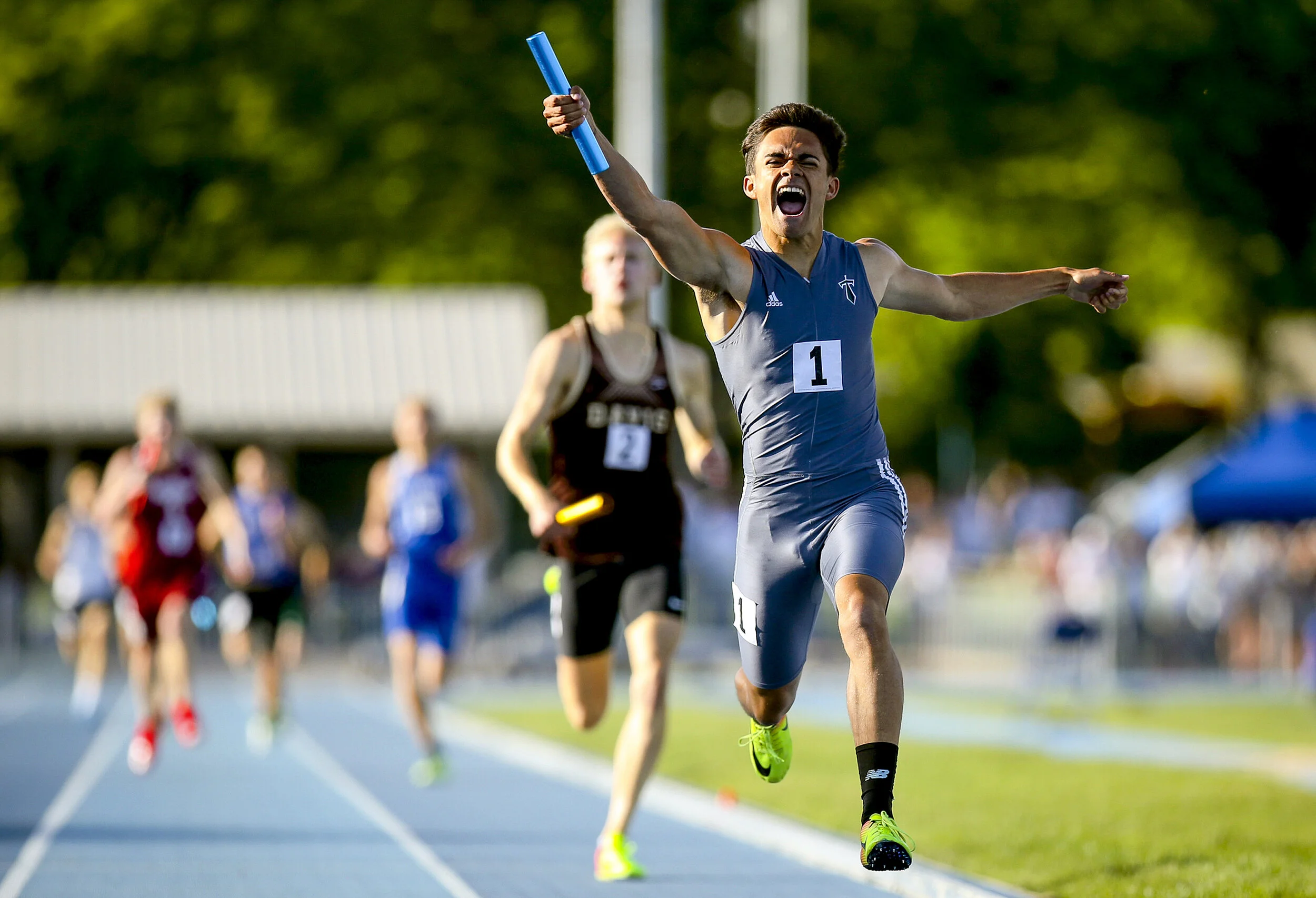 Syracuse's Nathan Kaufusi crosses the finish line in celebration after his team won their heat of the 6A boy's 4x4-meter relay during the UHSAA State Track and Field Championships on Friday, May 18, 2018 at Brigham Young University in Provo, Utah.
