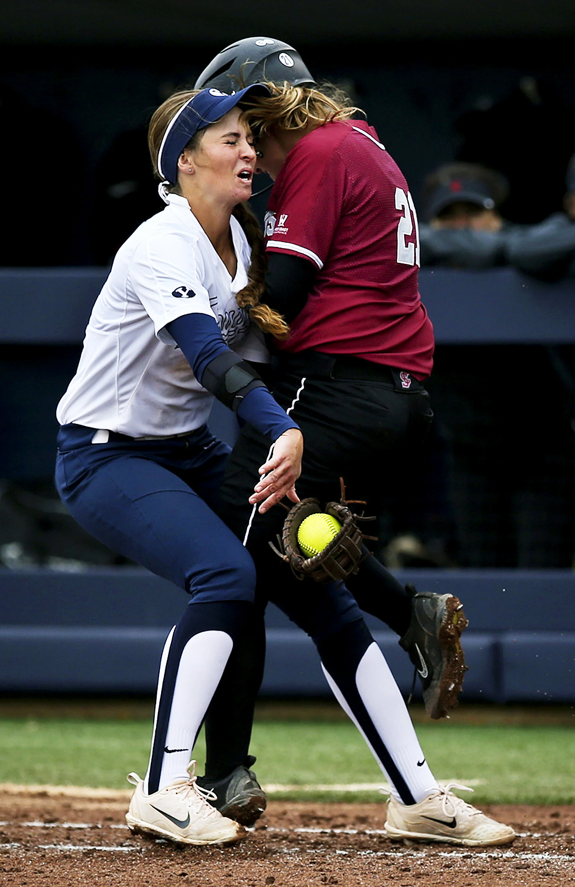 Santa Clara Broncos Katherine Sanchez (21) collides with Brigham Young Cougars first baseman Allie Hancock (27) as Sanchez runs to first base after her hit during the first game of a doubleheader between Brigham Young University and Santa Clara Unive