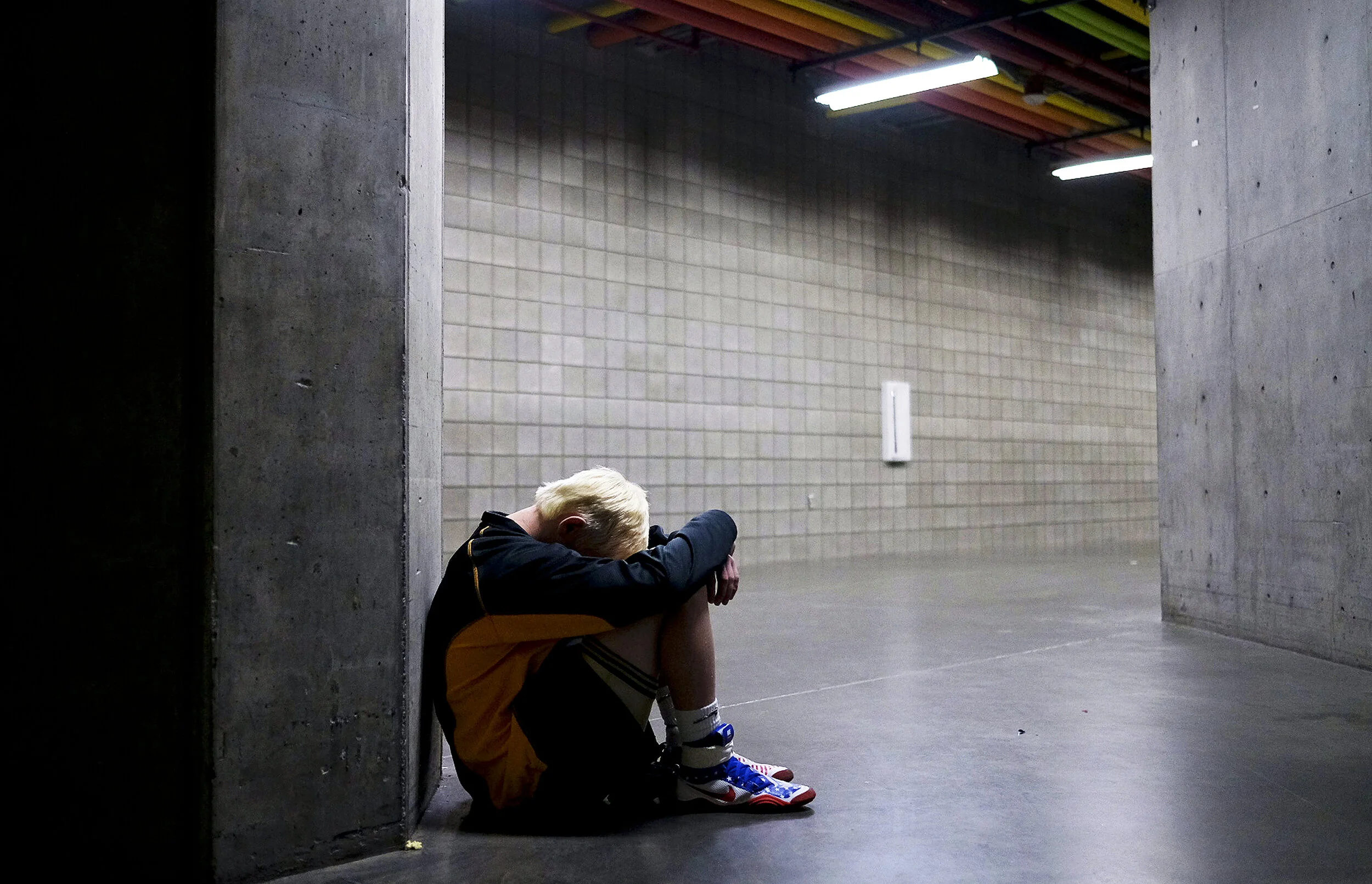 Wasatch's Sammy Heywood takes a moment to himself before the UHSAA 6A and 5A State Wrestling Championships on Thursday, Feb. 8, 2018, at the UCCU Center in Orem, Utah. Heywood went on to win the 5A state title in the 126-pound weight class.