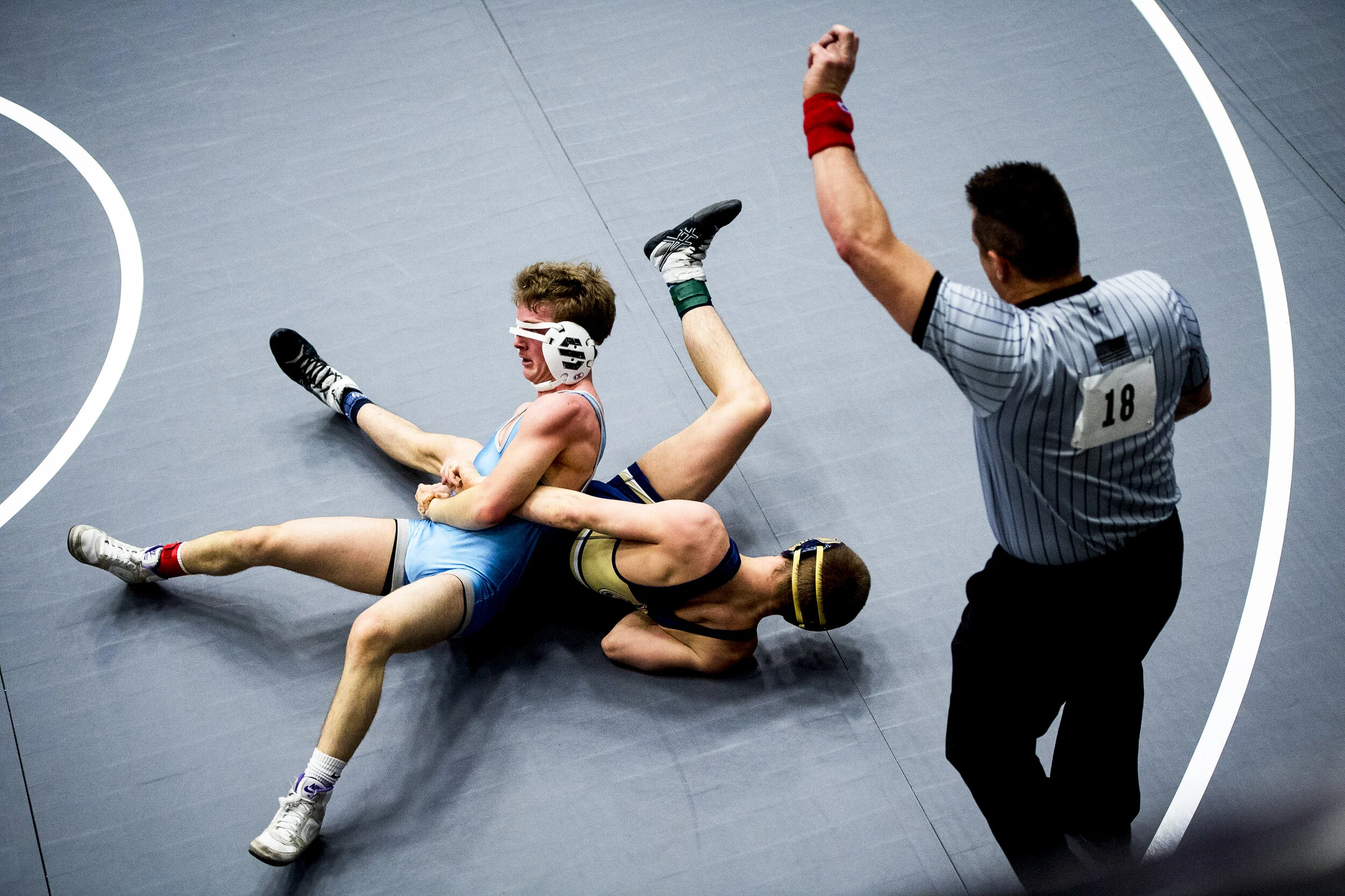Layton's Gage Howard holds down Westlake's Calvin Bishop as they wrestle in the 132-pound weight class during a preliminary match in the 6A division of the UHSAA State Wrestling Tournament held Wednesday, Feb. 13, 2019, at the UCCU Center in Orem, Ut