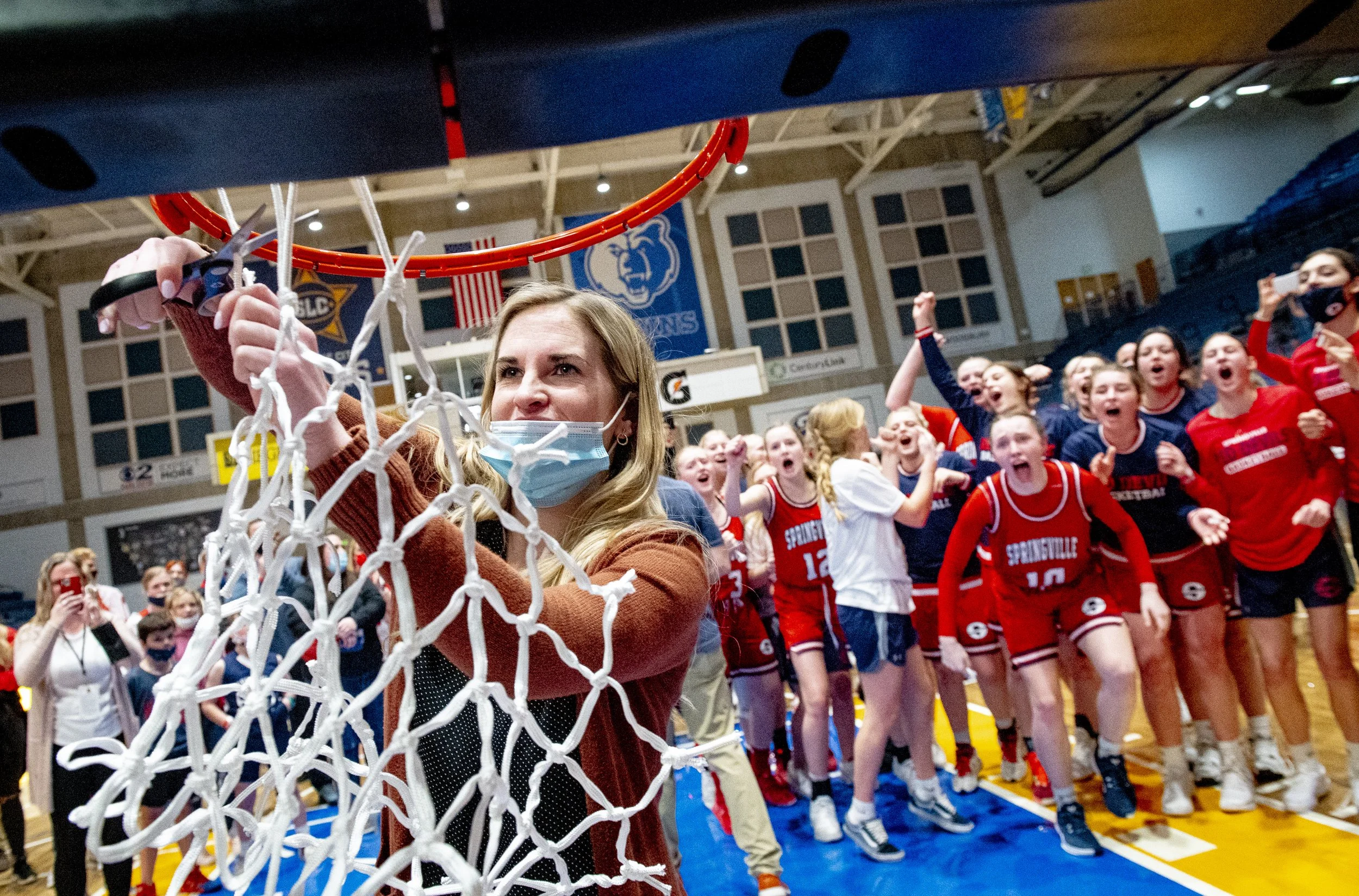 Springville head coach Holli Averett cuts down the net after the Red Devils defeated the Farmington Phoenix 39-38 in the 5A state championship game at Salt Lake Community College in Taylorsville, Utah, on Saturday, March 6, 2021.