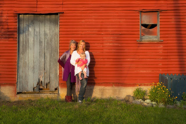 family_red_wall_3_generations.jpg