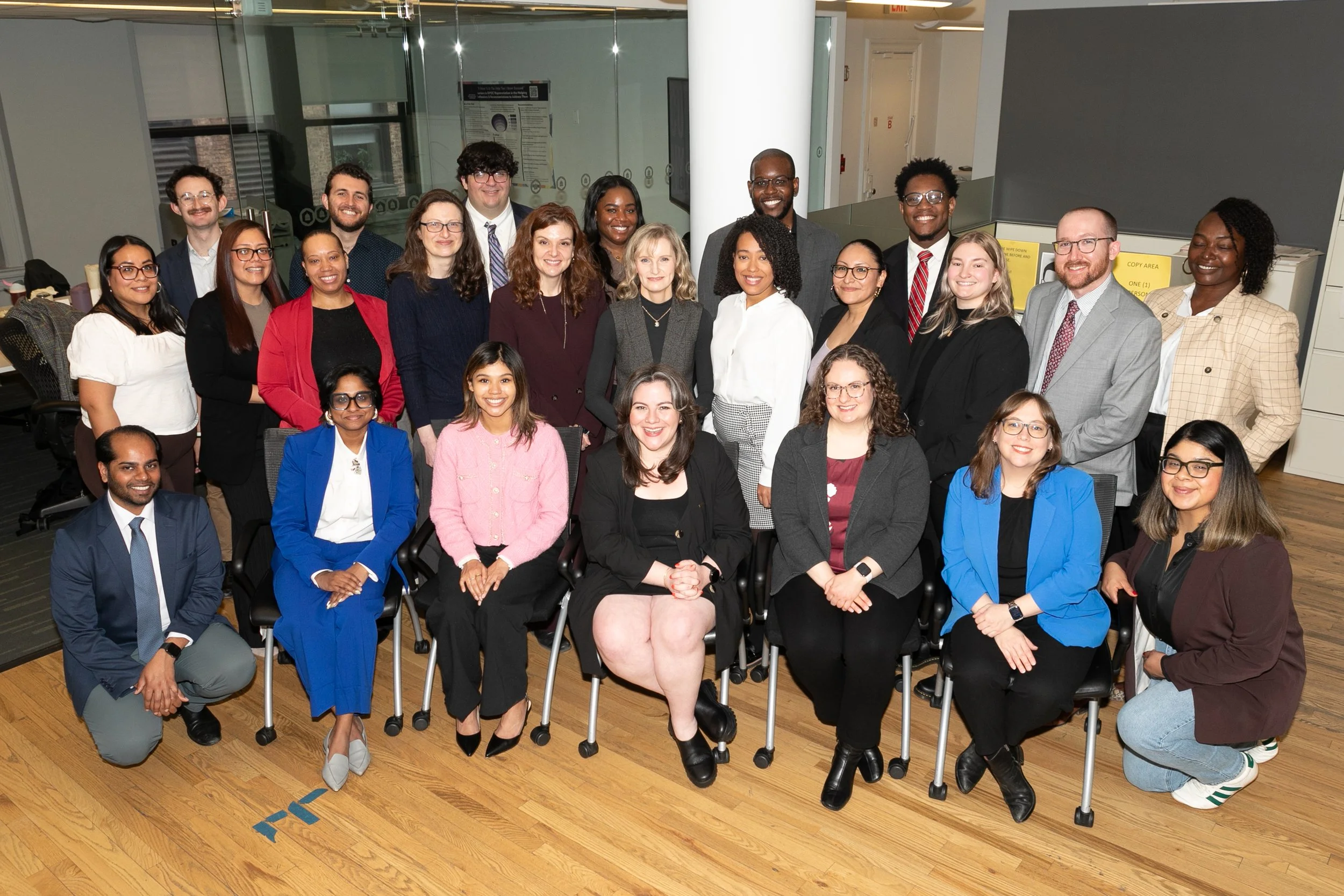 The 2025-2026 cohort of Kriegel Fellows smile, posing for a group photo in the ISLG offices.