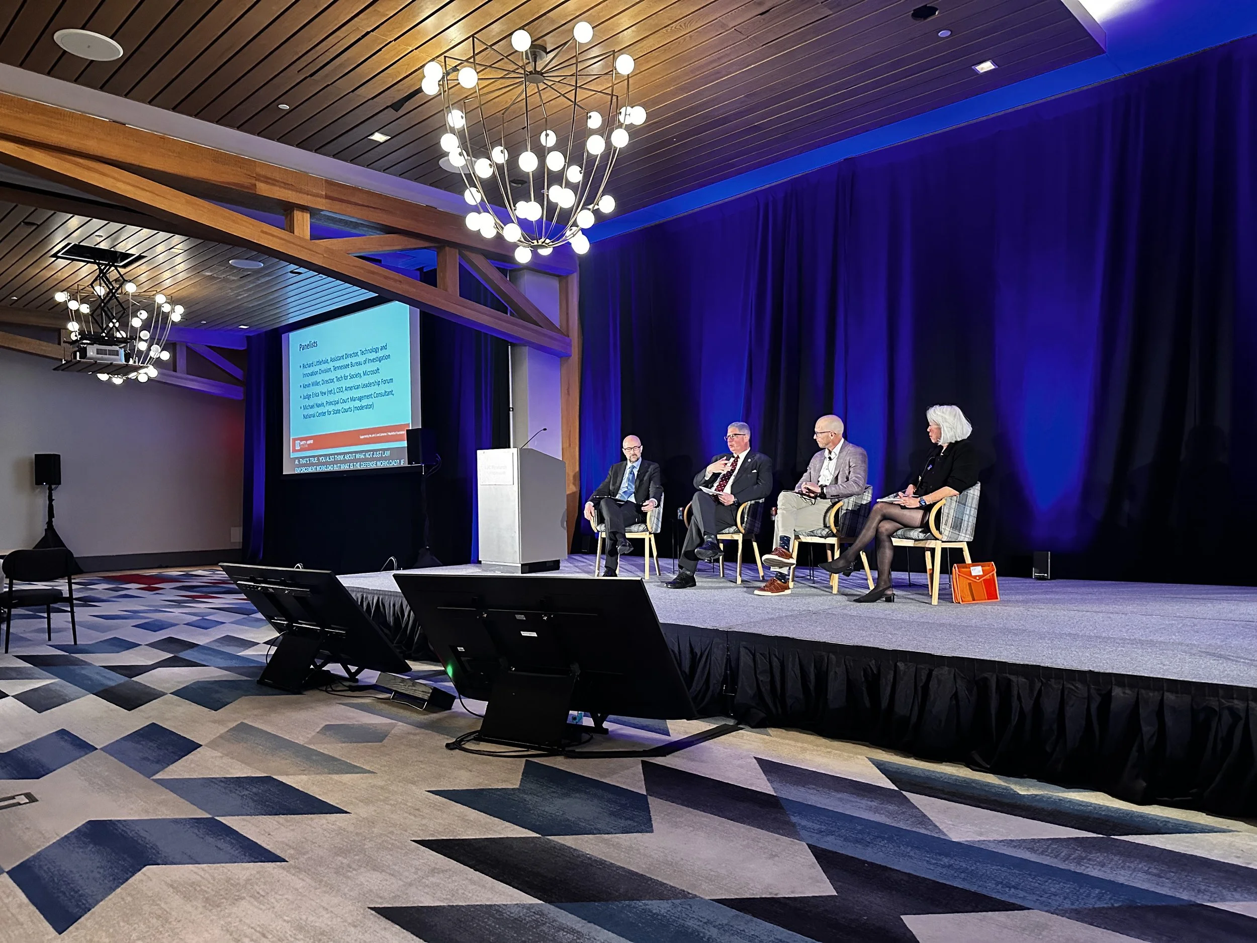 National Center for State Courts' Michael Navin, Judge Erica Yew (ret.), Microsoft's Kevin Miller, and Tennesee Bureau of Investigation's Richard Littlehale share the stage to discuss artificial intelligence in criminal legal systems.