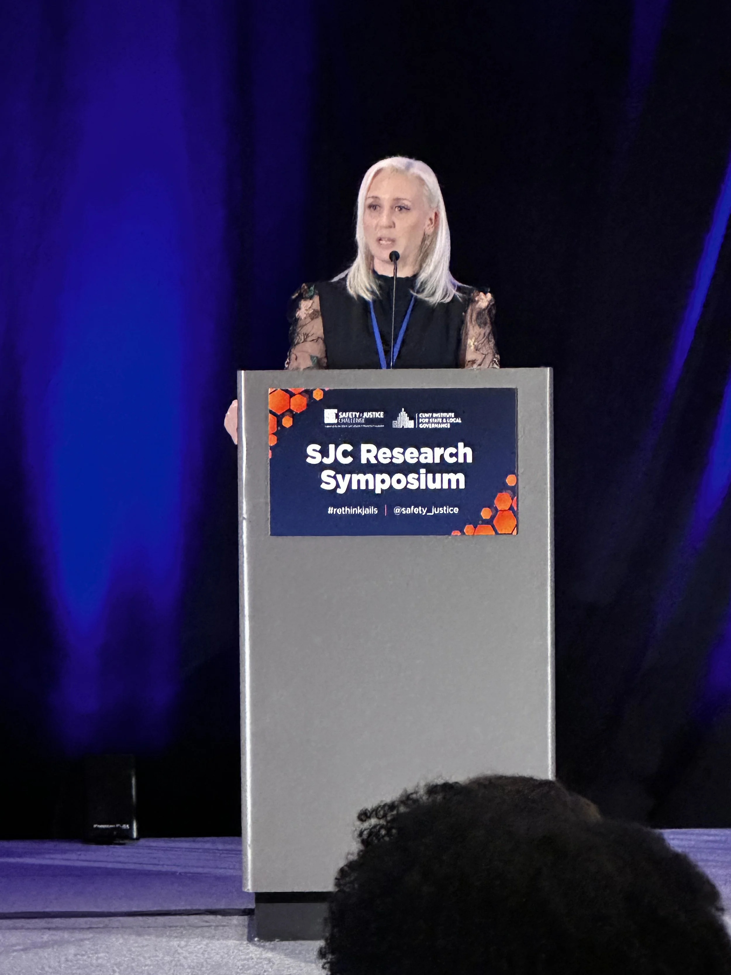 ISLG Research Director Jennifer Ferone speaks at the 2026 SJC Research Symposium