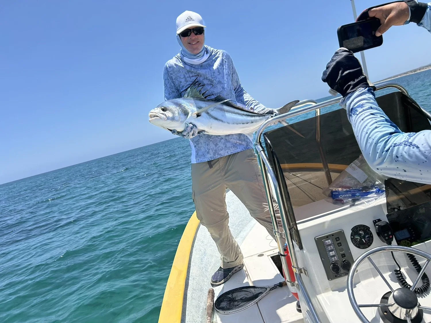 L3 Rods Client holding up a fish he caught with a custom fishing rod he bought from L3 Rods