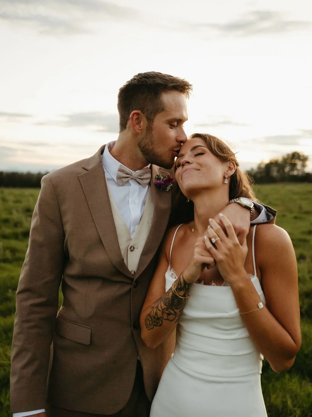 We cannot get over our beautiful bride @aubaneypalmer in the 2328 gown by @mikaellabridal!✨ She made it her own by adding chantilly lace to the neckline, and to say we&rsquo;re obsessed with it is an understatement. 

Photography: @kyra.film.photo 

