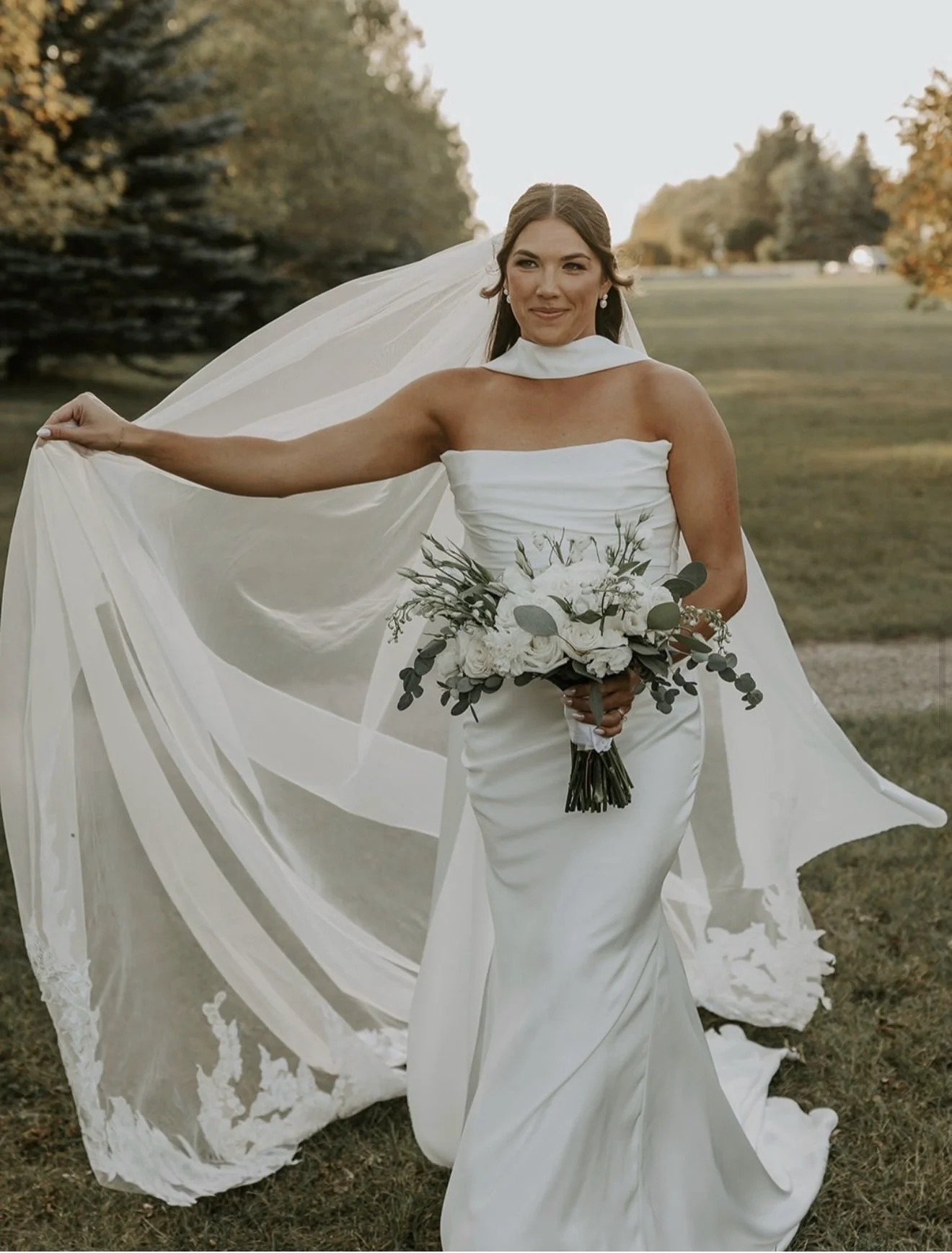 real bride from wearing  a draped silk wedding gown cathedral veil and scarf. Tres chic