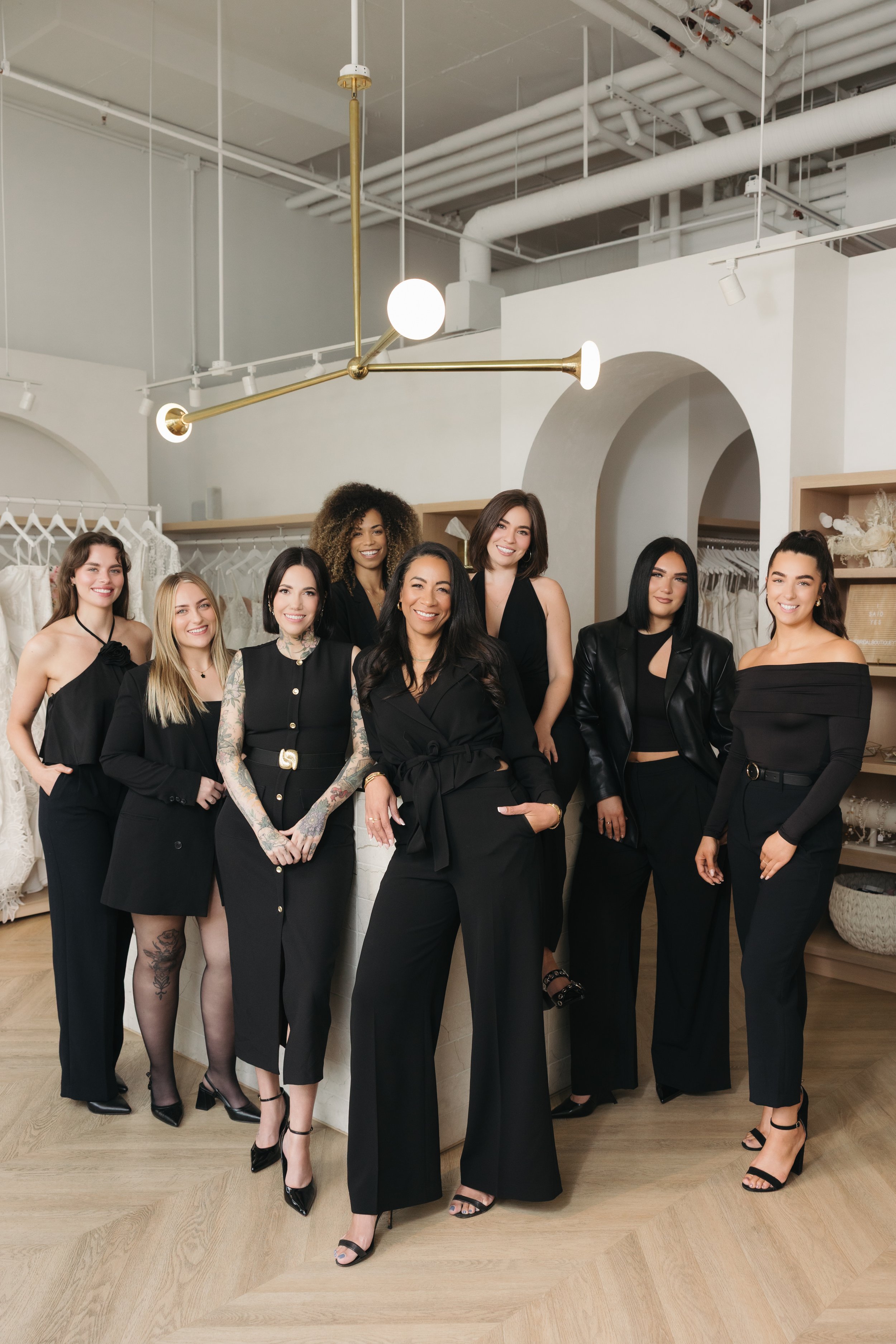 A group of fashion forward beautiful cool girl stylist that work at The Bridal Boutique in Western Canada. Looking chic and elevated.