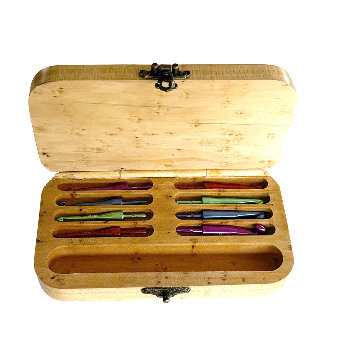 Wooden Crochet Hook Set made from Macrocarpa. Has laser engrave text saying I am not a cheap hooker. Lid is open with eight interchangeable hooks ranging from 3mm to 7mm