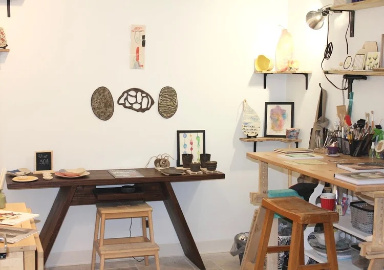 The Gasper Arts studio space with worktables and stools