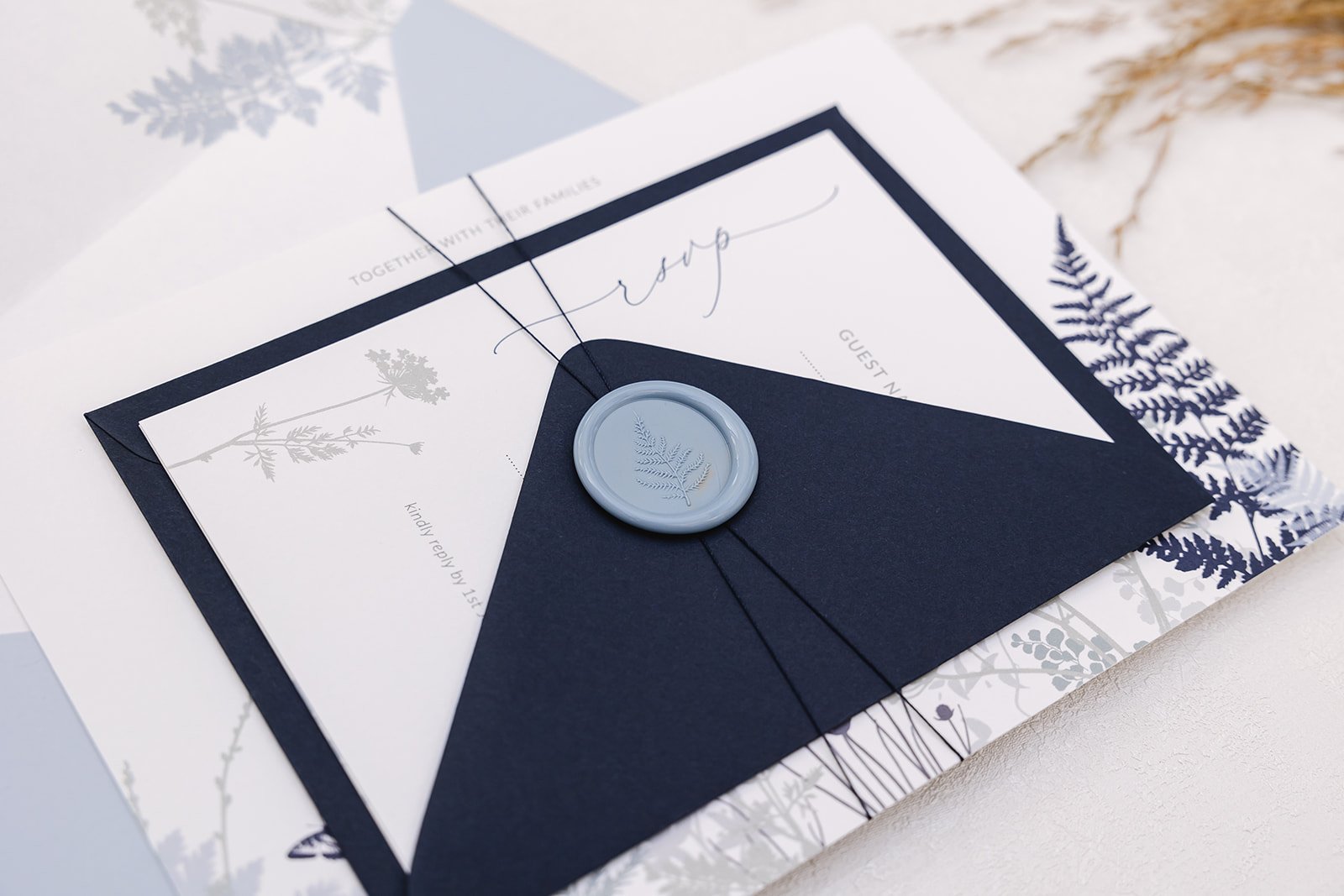 Day invite and RSVP bound with wax seal in 'Sky'