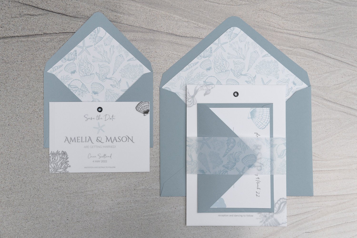 Black vellum overlays with lined 'Sea Blue' envelopes and vellum belly band
