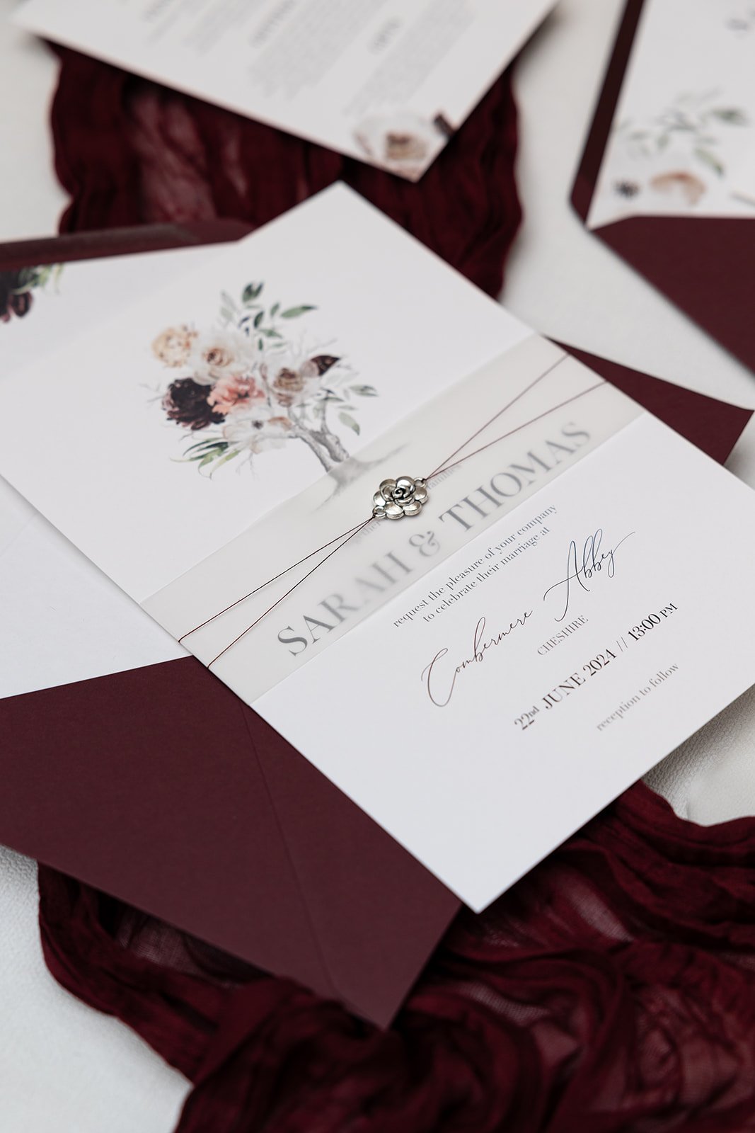 Splendour Charmed Invite™ with plain vellum belly band and lined 'Claret' envelope