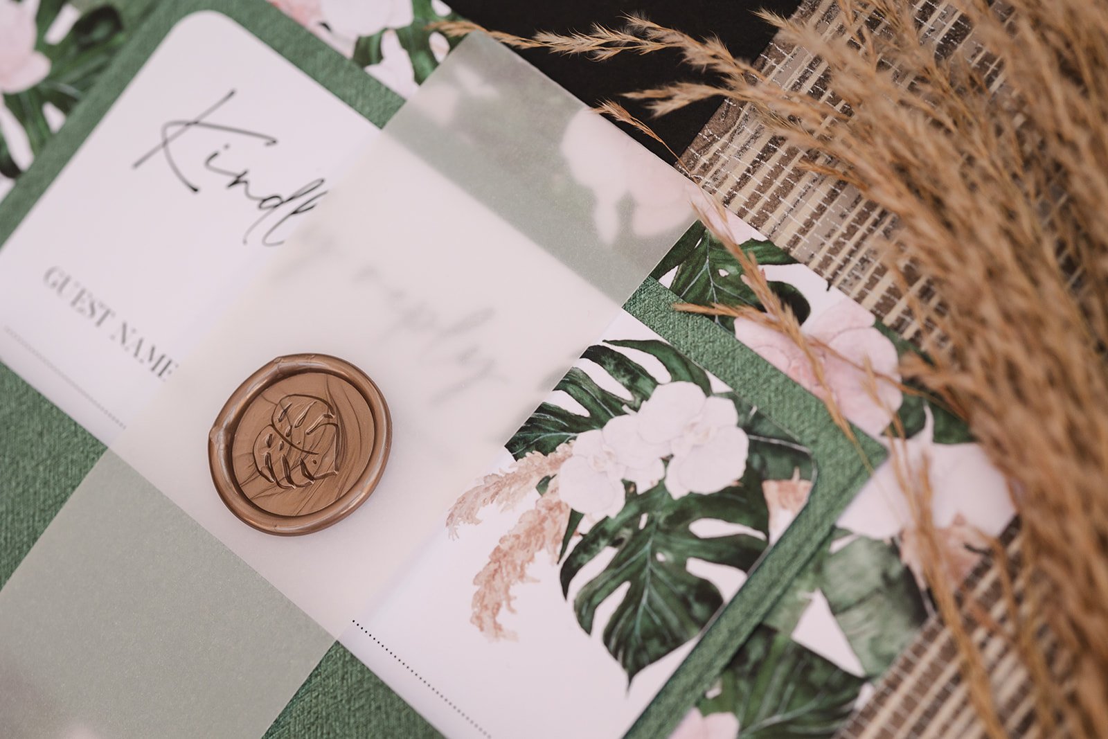 Day invite set with Monstera Green envelope and plain vellum belly band with wax seal in Pampas
