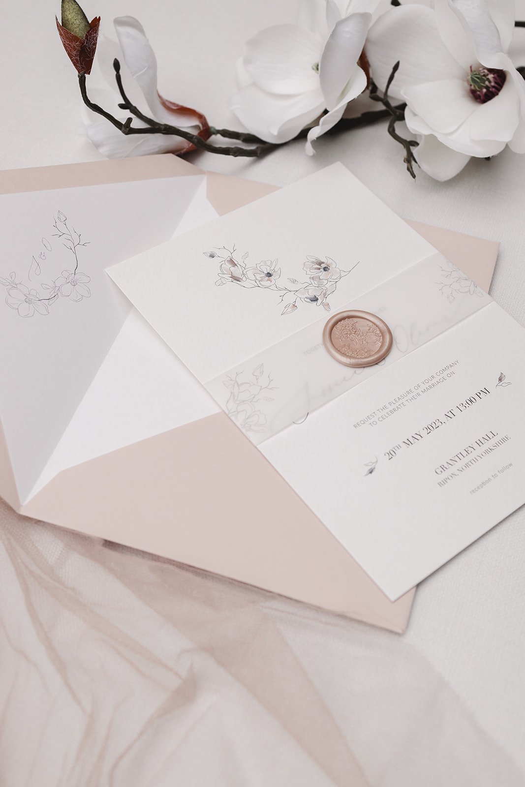 Day invite with Blush envelope and white liner, and vellum belly band with Bouquet design wax seal in 'Blushing'