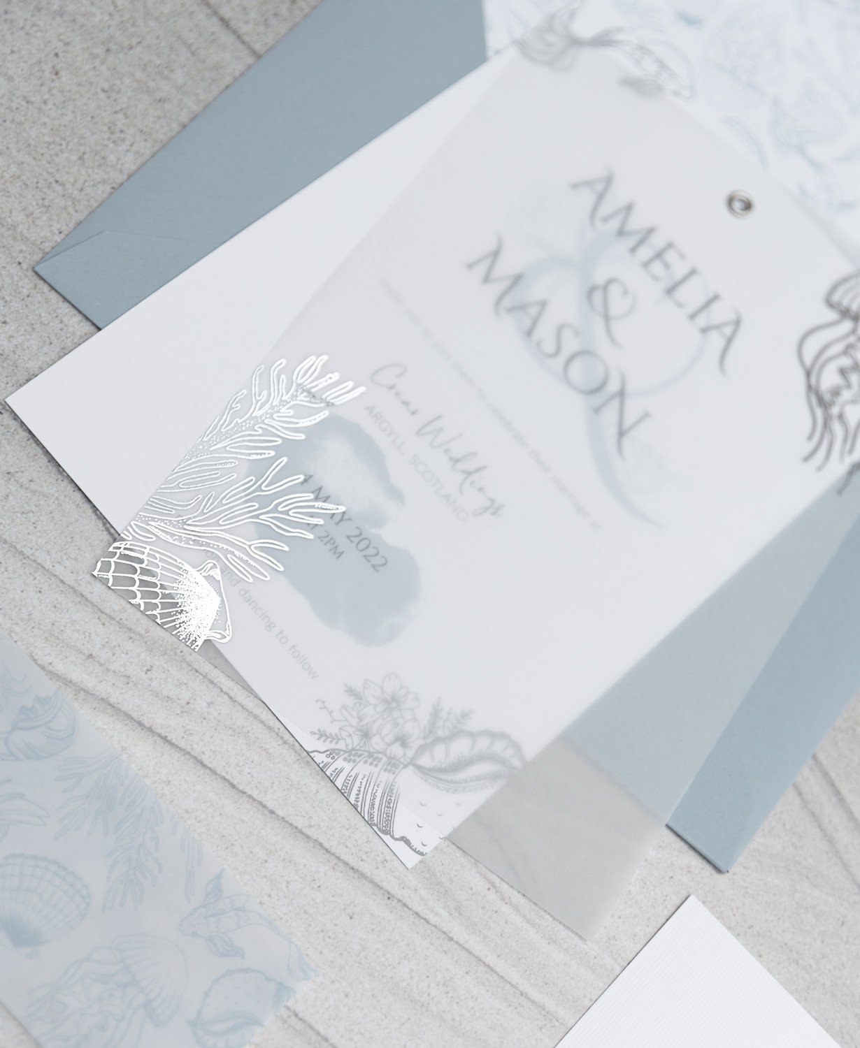 Silver-foiled sea illustrations vellum overlay on Day invite