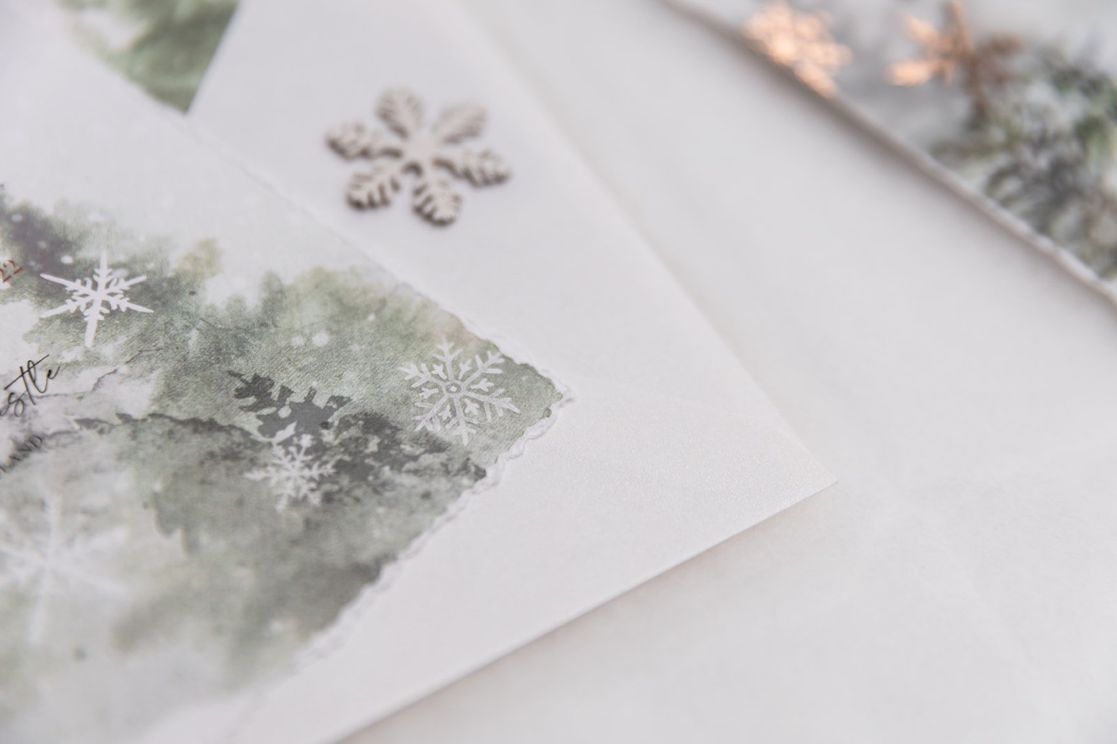 Close up of hand-deckled edge and 'Frost White' envelope