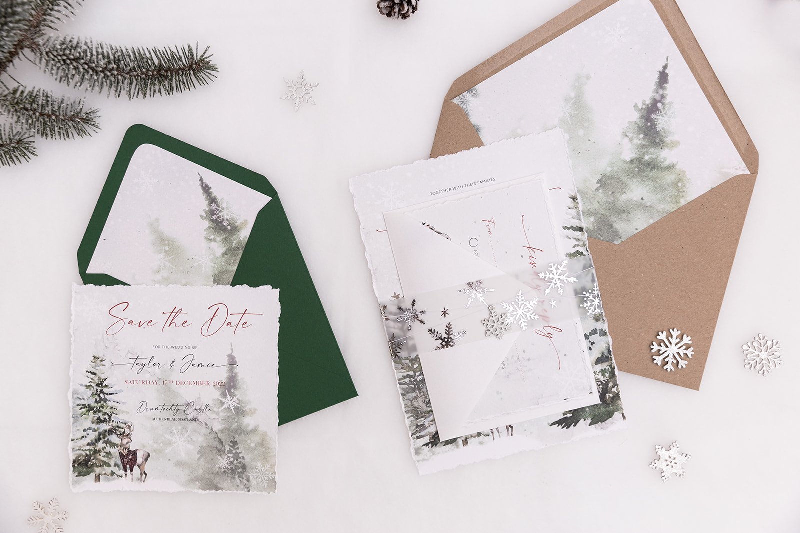 Winter Frost Charmed Invite™ with mix-and-match envelopes and silver-foiled snowflakes vellum belly band, with enamelled snowflake charm