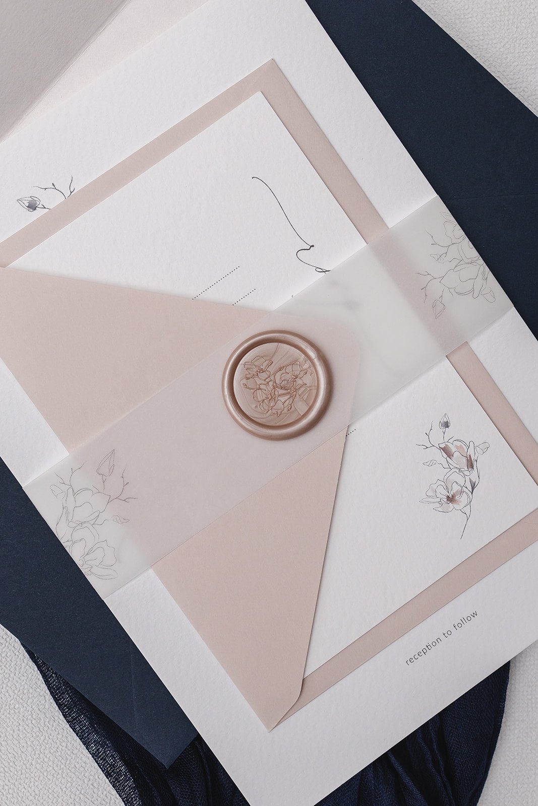 Day invite with vellum belly band and Magnolia design wax seal in 'Blushing'