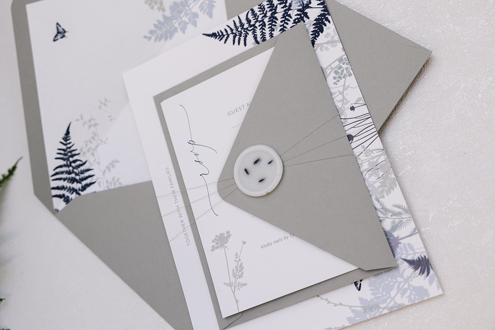Day invite and RSVP bound with vellum wax seal and dried lavender, with 'Fern' envelopes