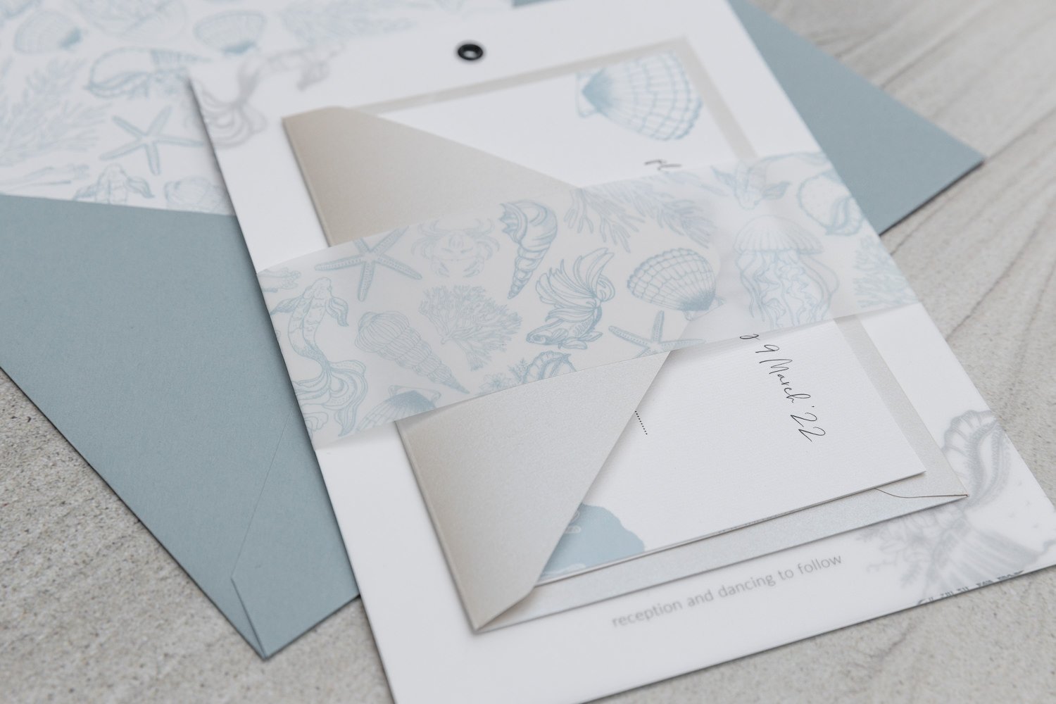 Beachcomber collection with black vellum overlay, vellum belly band, RSVP envelope in 'Mother of Pearl' and lined 'Sea Blue' envelope