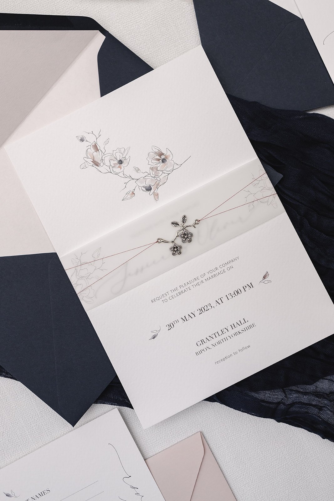 Grace collection Charmed Invite™ with rose colour thread and illustrated vellum belly band