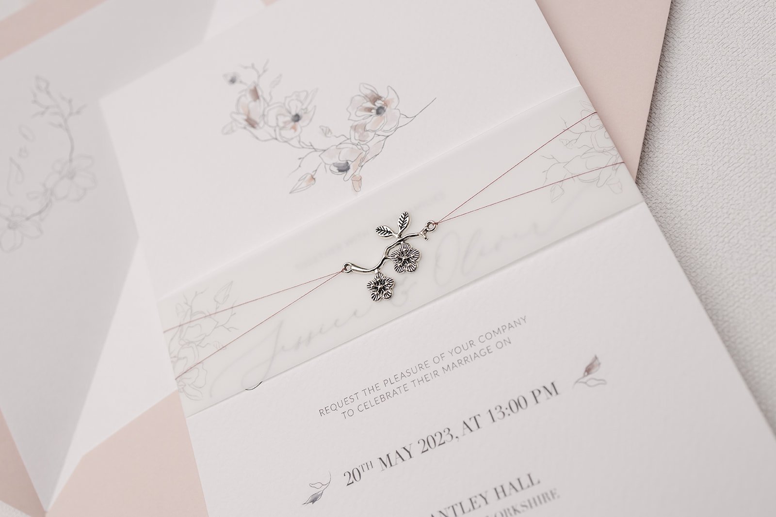 Grace collection Charmed Invite™ with rose colour thread and illustrated vellum belly band