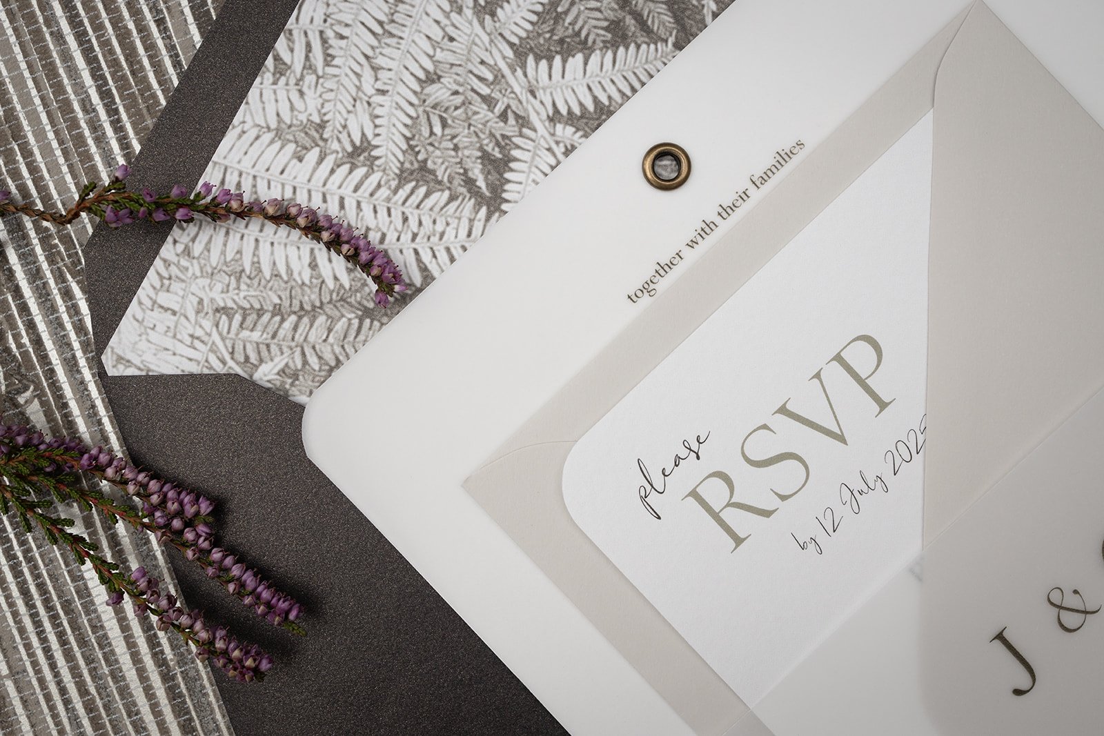 Invite with 'Limestone' and 'Bronzed Peat' envelopes, with bronzed ferns envelope liner.