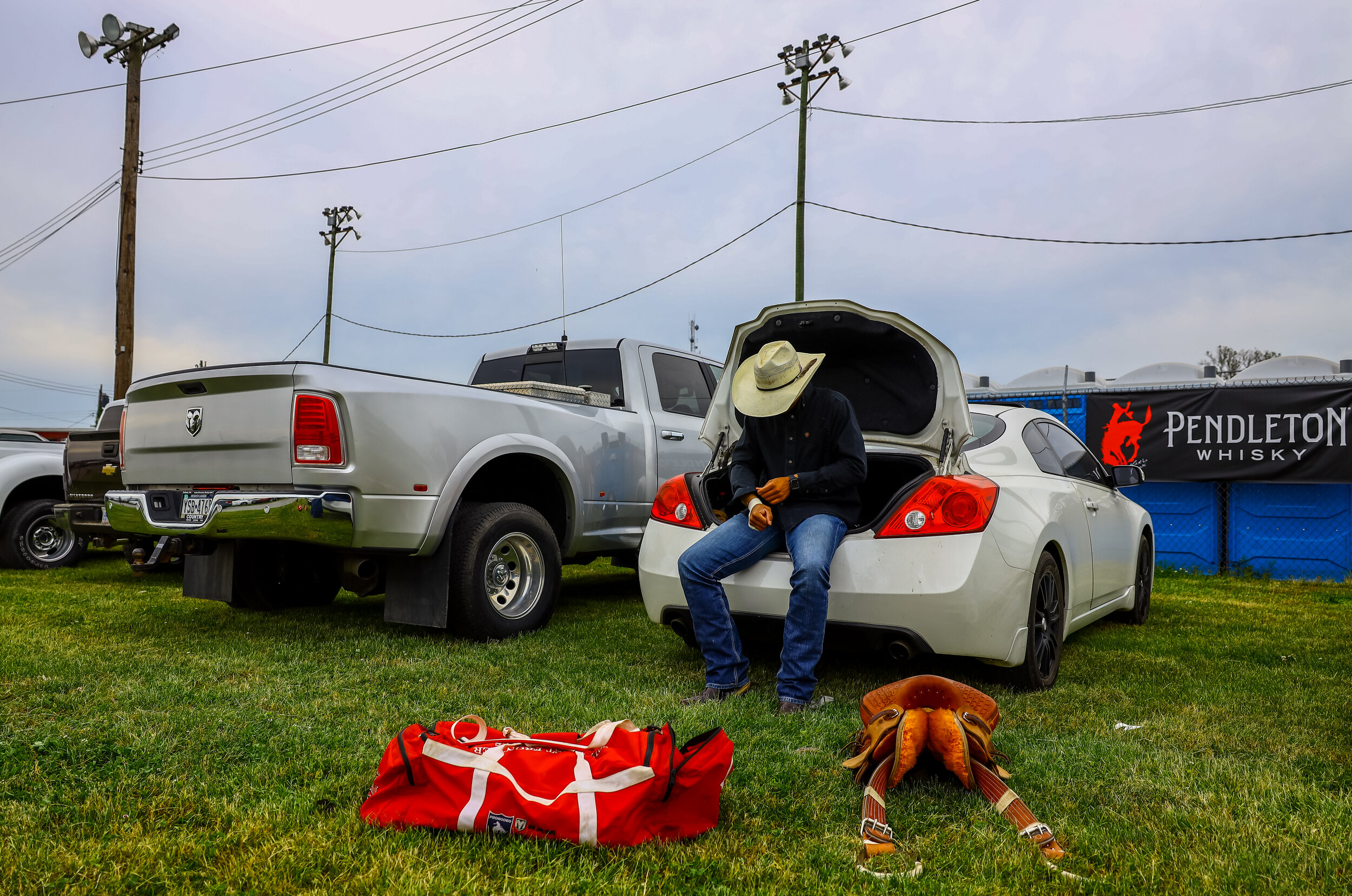 Bull rider Jason Scales, of Ridgeway, VA, tapes his wrists prior to the night's opening event. Scales has been bull riding for three years, mainly at Cowtown.