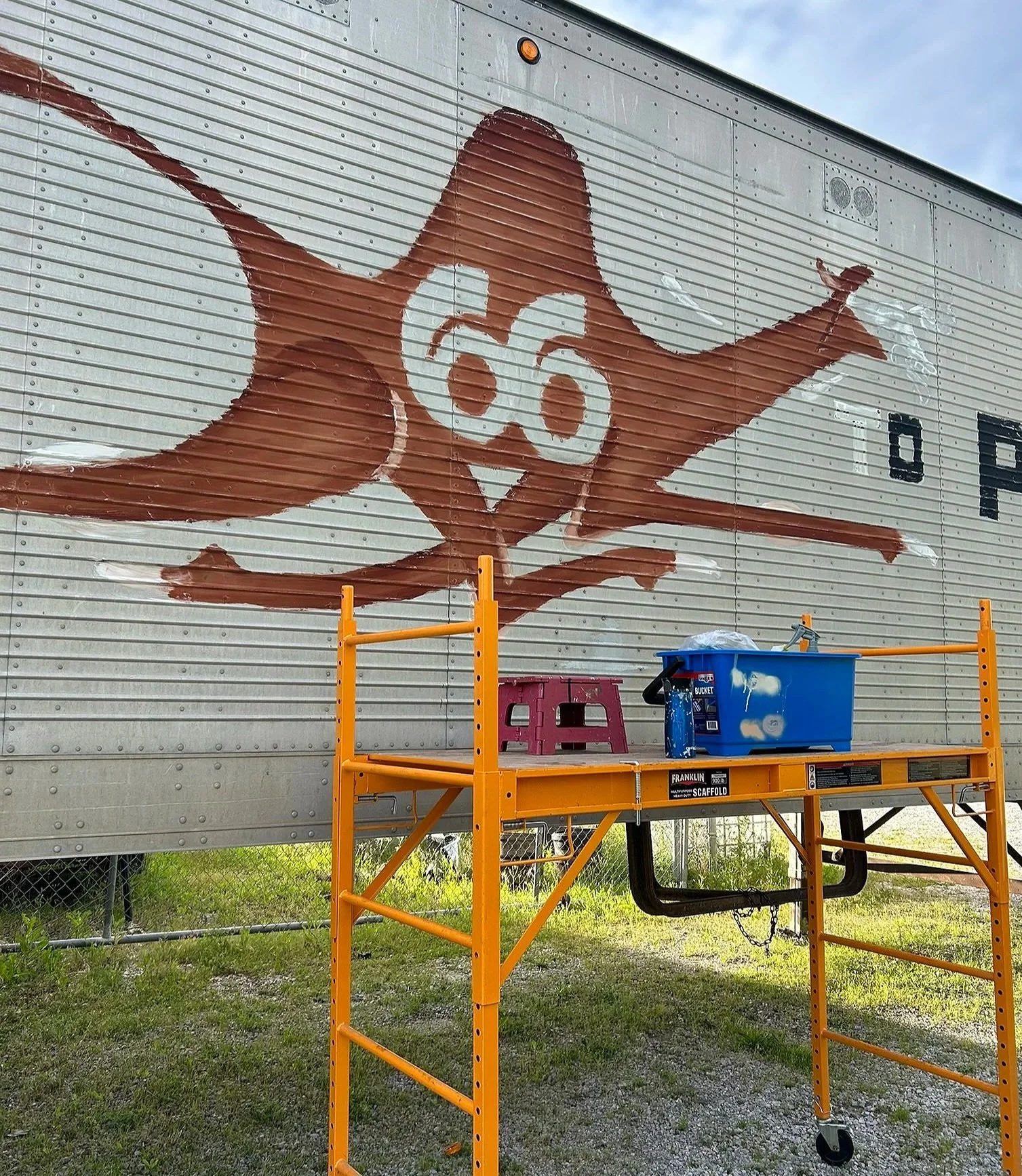 Before Restoration: 1970's hand-painted logo on Campbell 66 Express semi-truck trailer. 2026. 
