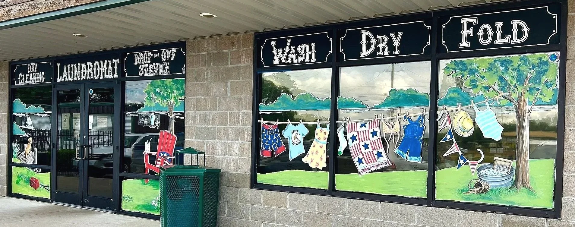 Window Art for Washboard Laundry in Grove, Oklahoma. (The transom lettering was not my work.) The panes on either side of the door are each 4'x7' and the 3 side panes total 5'x11'. 2026.