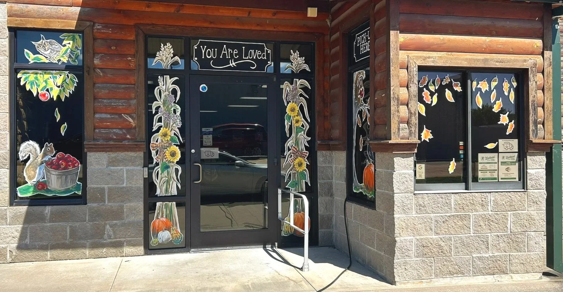 New Autumnal Window Paintings and Updates around the Door, South Side of the Washboard Laundry in Grove, OK. 2026.