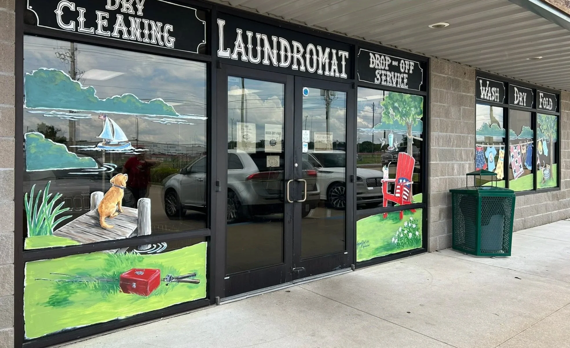 Summer Window Art for Washboard Laundry in Grove, Oklahoma. (The transom lettering was not my work.) The panes on either side of the door are each 4'x7' and the 3 side panes total 5'x11'. 2026.