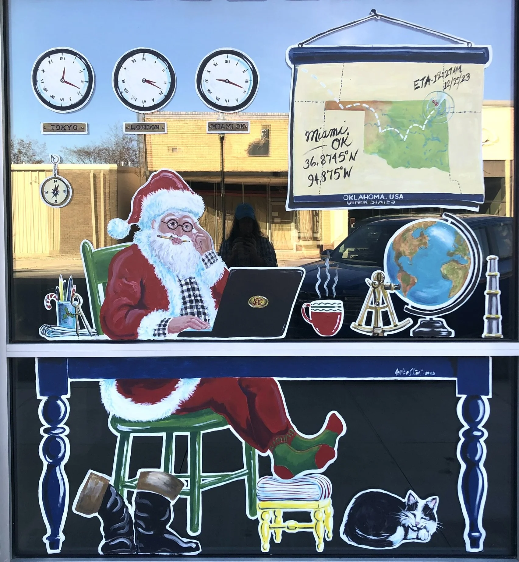 Santa Navigating to Miami, OK. Window painting at Miami Convention & Visitors Bureau. 7.5'x 6.5'. 2023.