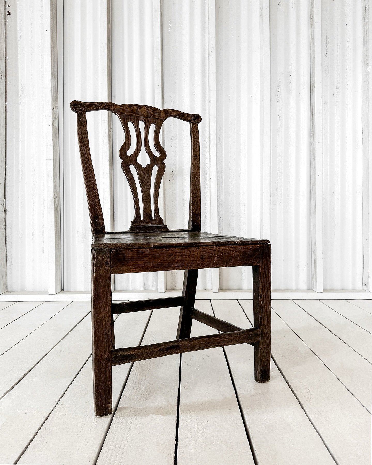 [Available]. Crafted in the late 18th-century England, the Chippendale-style chair remains a study in balance. The pierced back splat, with its fluid symmetry, shows off the craftsmanship that defined the Georgian era.

A warm patina adds depth to th