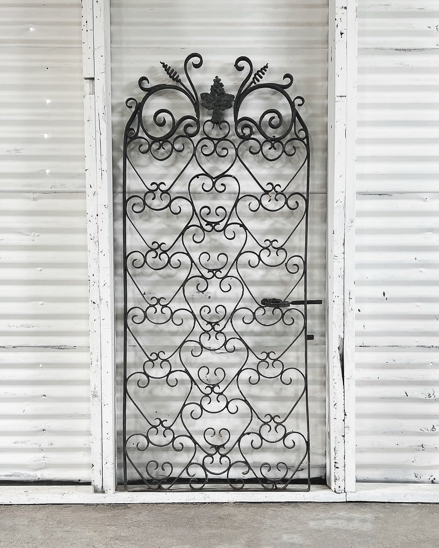 [Available] Plucked from a French wine cellar&mdash;or maybe just from a dream of one&mdash;this antique wrought iron gate brings all the vineyard vibes. 

Crafted in the late 18th century, it features beautifully aged scrollwork, heart-shaped flouri